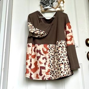 Women’s long sleeve fun poly top. NWT